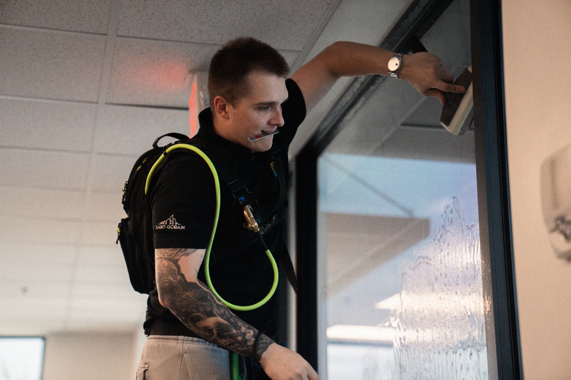 Window film installer applying film