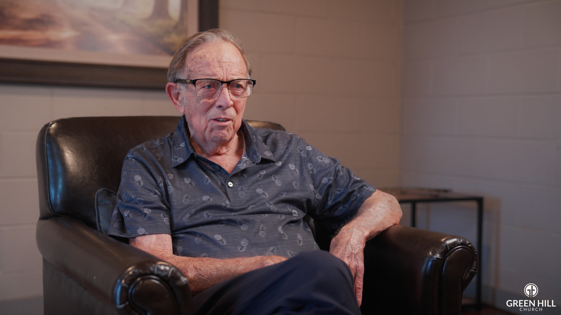Church member seated in leather chair